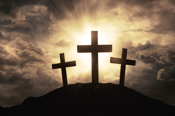 three crosses symbol on mountain peak