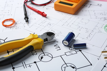 Wall Mural - Different electrical tools on paper circuit drawing background