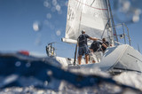 Aft of sailing boat with skipper from underwater view