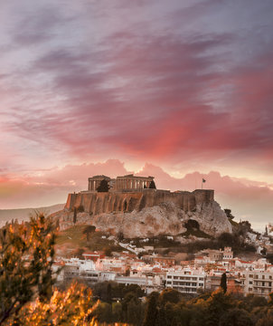 acropolis with parthenon temple against sunset in athens, greece