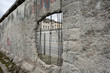 Germany, Berlin, documentation center Topography of Terror: Detail of the old Berlin wall with buildings in the background.