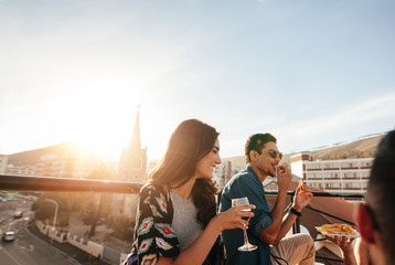 Wall Mural - Group of friends partying on rooftop