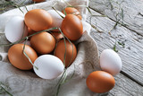 Fototapeta Mapy - Fresh chicken brown eggs on rustic wood, organic farming concept