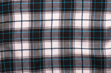 white-black textile texture of the checkered shirt useful as background
