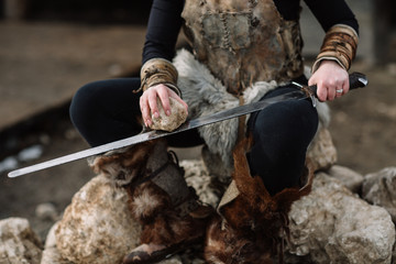 portrait of a girl in a Viking outfit, red hair.