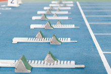 Start Line With Starting Blocks For Sprint Running On Track An Field Venue