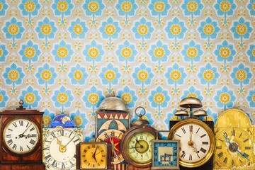 Wall Mural - Colorful vintage clocks in front of retro wallpaper