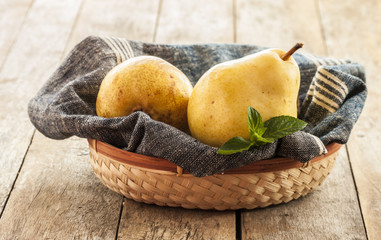 Wall Mural - Fruit background. Fresh organic pears on old wood. Pear autumn harvest