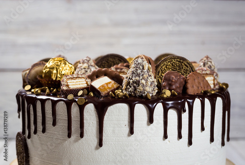 Chocolate Cupcakes Decorated With Candy Cookies And Candy Bars
