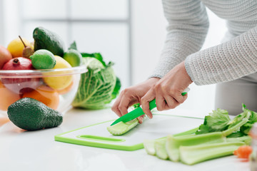 Woman chopping celery