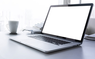 Wall Mural - Laptop with blank screen on desk with big window in modern office.business concept