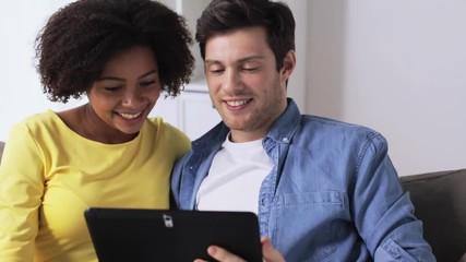 Poster - smiling happy couple with tablet pc at home