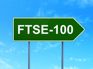 Wall Mural - Stock market indexes concept: FTSE-100 on road sign background