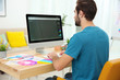 © Africa Studio - Young designer working at computer