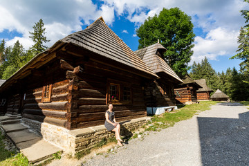 Wall Mural - Girl in the historical ancient museum village Zuberec Brestova in Slovakia