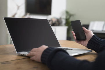 laptop and smartphone user