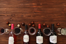 Wine And Chocolates On Wooden Background