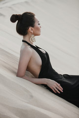 Wall Mural - Professional photo shoot of beautiful young asian woman in desert