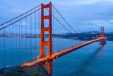 Fototapeta Mosty linowy / wiszący - Golden Gate Bridge at Dusk - A cloudy winter evening view of Golden Gate Bridge, looking from Hilltop at Marin Headlands toward San Francisco Peninsula at south. San Francisco, California, USA. 