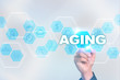© WrightStudio - Medical doctor drawing aging on the virtual screen.