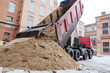 the truck pours the sand