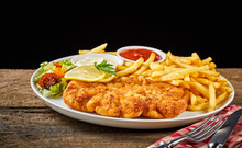 Dish Of Wiener Schnitzel And French Fries