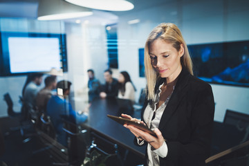 Wall Mural - Business woman holding a tablet in conference room