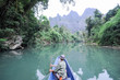 © fotoember - People traveling in a canoe on the river