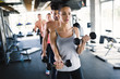 © NDABCREATIVITY - People working out together in gym