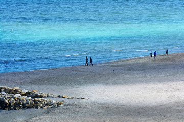 Wall Mural - Walking on the shore of the beach