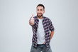 © Drobot Dean - Smiling Bearded man in shirt showing thumb up at camera