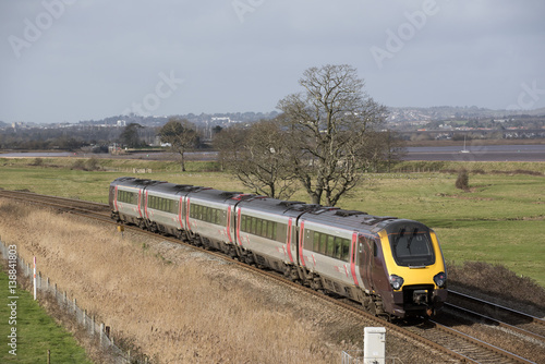 Cuadros en Lienzo A Virgin Trains company passenger train passing through English countryside sout
