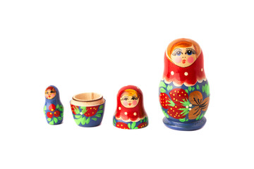 Russian doll - matreshka isolated on white background, hand-painted, traditional souvenir. All dolls can be gathered inside big one.