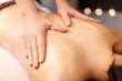 © Syda Productions - woman lying and having back massage at spa