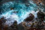 Fototapeta Storczyk - Blue raging waves crashing on the rocks in tne Atlantic ocean