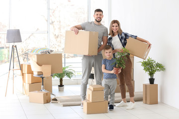 Wall Mural - Happy family with cardboard boxes. Moving concept