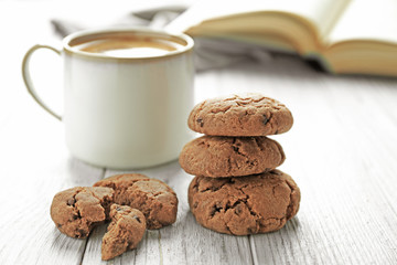 Wall Mural - Delicious homemade cookies and cup of coffee on wooden table