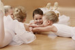 © Africa Studio - Group of beautiful little ballerinas resting on the floor