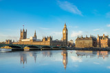 Fototapeta Big Ben - Big Ben and Westminster parliament with colorful sky and water reflection