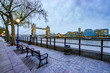 Empty bench and Tower Bridge viewed from Tower of london side of the Thames river
