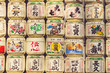 TOKYO, JAPAN - MARCH 30: A collection of Japanese sake barrels stacked is at the Japanese Meiji Shrine.