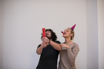 Poster - romantic young  couple celebrating  party with confetti