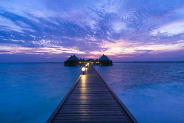 Wall Mural - Luxury Resort Angaga.  Ari Atoll. Fantastic sunset on a tropical island in the Maldives.