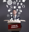 © Egor - Business, Technology, Internet and network concept. Young businessman shows the word: Code of conduct
