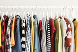 Collection of clothes hanging on rack