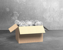 Open Cardboard Box With Light Bulbs