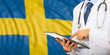 © Rawf8 - Doctor on Sweden flag background. 3d illustration