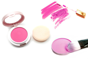 Makeup blush and lipgloss on white background