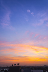 Wall Mural - sunset sky with rays of light shining clouds and sky background and texture