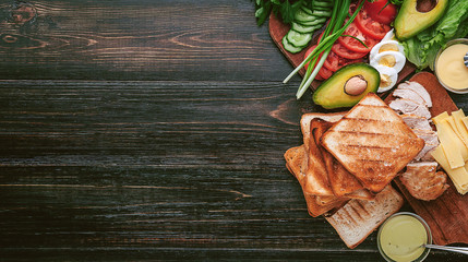 Ingredients for a tasty and appetinogo turkey sandwich with chicken and vegetables